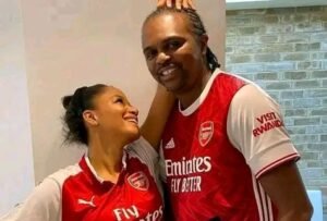 Kanu and his wife on Arsenal jersey. 